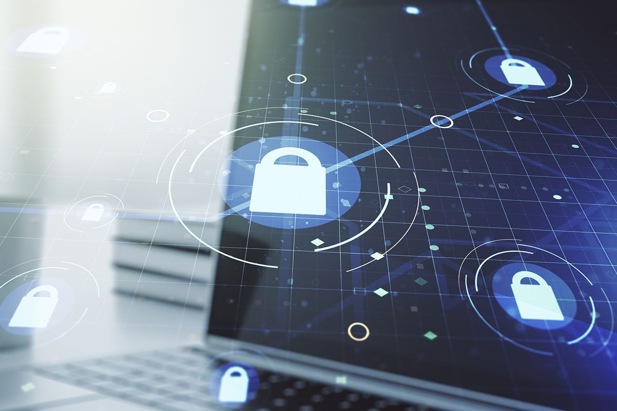 A laptop screen displays a digital interface with padlock icons and connected lines, symbolizing cybersecurity and data protection.