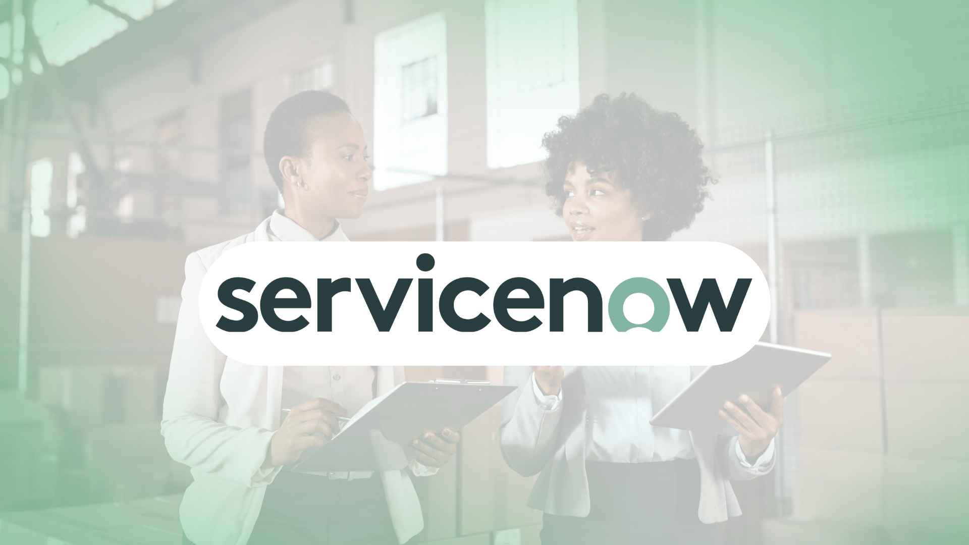 Two business professionals holding clipboards talk in a warehouse. The ServiceNow logo is centered and semi-transparent, overlaying the image.